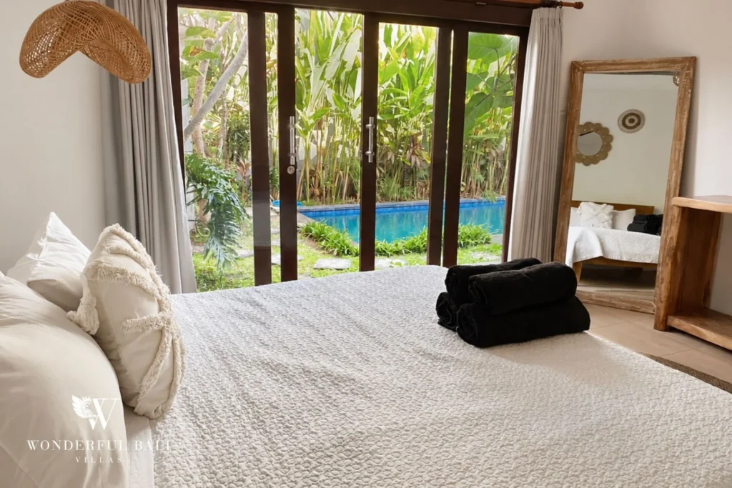 Boho bedroom opening to the pool at a villa in Batu Bolong, Canggu