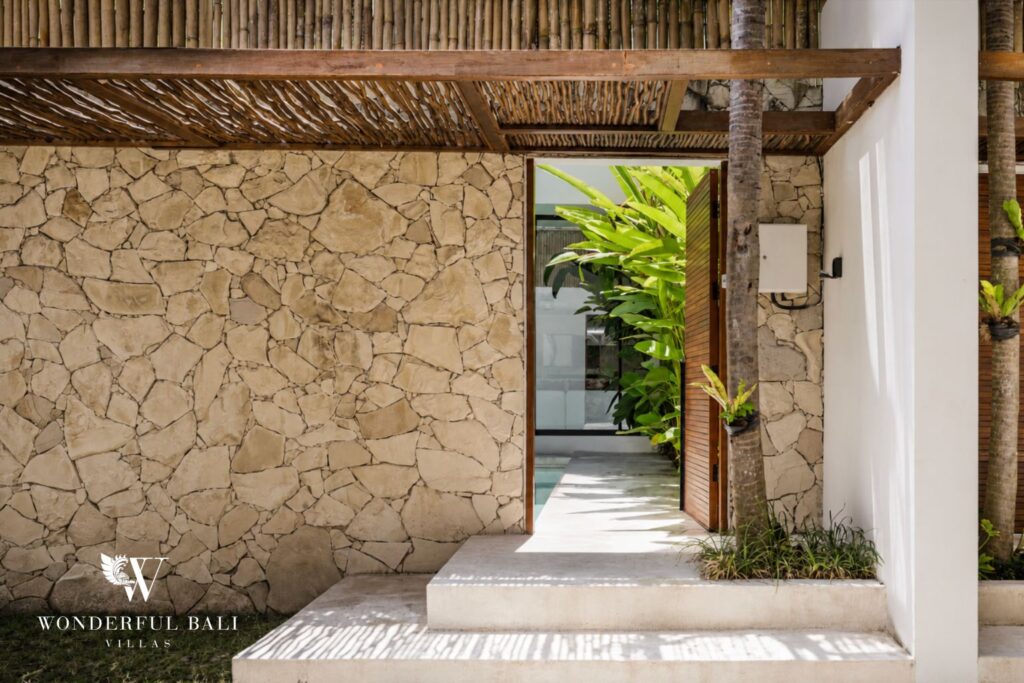 Outdoor shower with stone detail at a villa in Petitenget, Seminyak