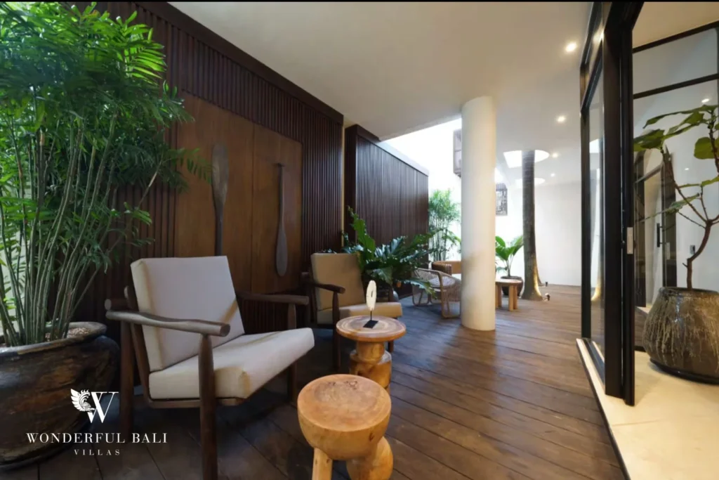 Covered timber deck lounge with slatted screen wall in a 4-bedroom villa in Canggu Bali