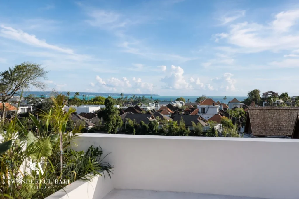3BR ocean-view villa in Seseh — rooftop view over rice fields to the ocean
