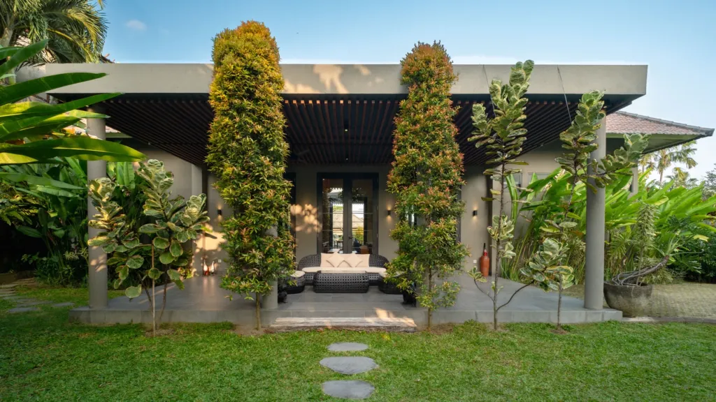 Villa exterior at dusk at M Villa 318, a 5-bedroom private-pool villa a short walk from Batu Bolong Beach in Canggu, Bali