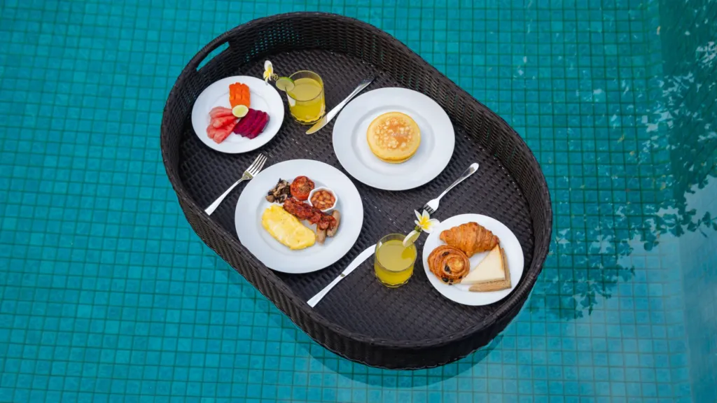 Floating breakfast at M Villa 318, a 5-bedroom private-pool villa a short walk from Batu Bolong Beach in Canggu, Bali