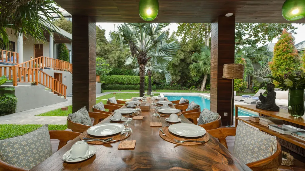 Poolside dining at M Villa 318, a 5-bedroom private-pool villa a short walk from Batu Bolong Beach in Canggu, Bali