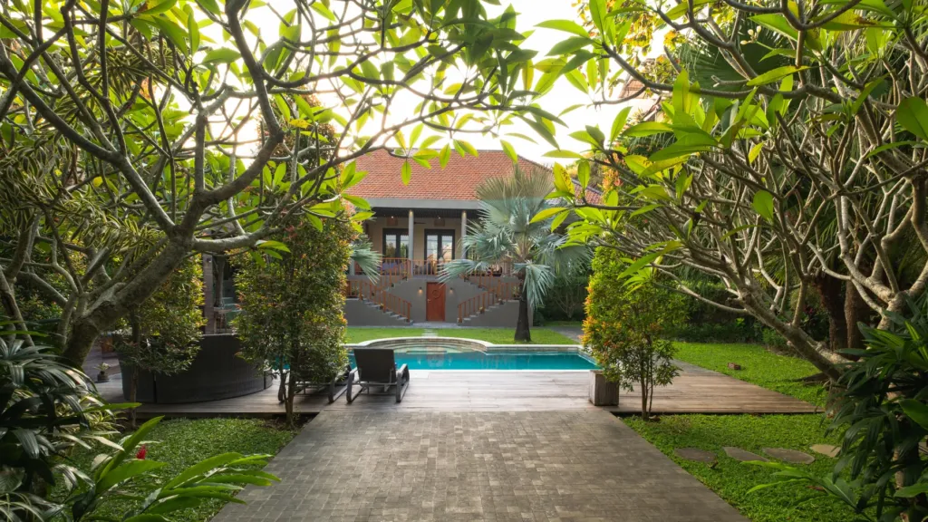 Tropical garden at M Villa 318, a 5-bedroom private-pool villa a short walk from Batu Bolong Beach in Canggu, Bali