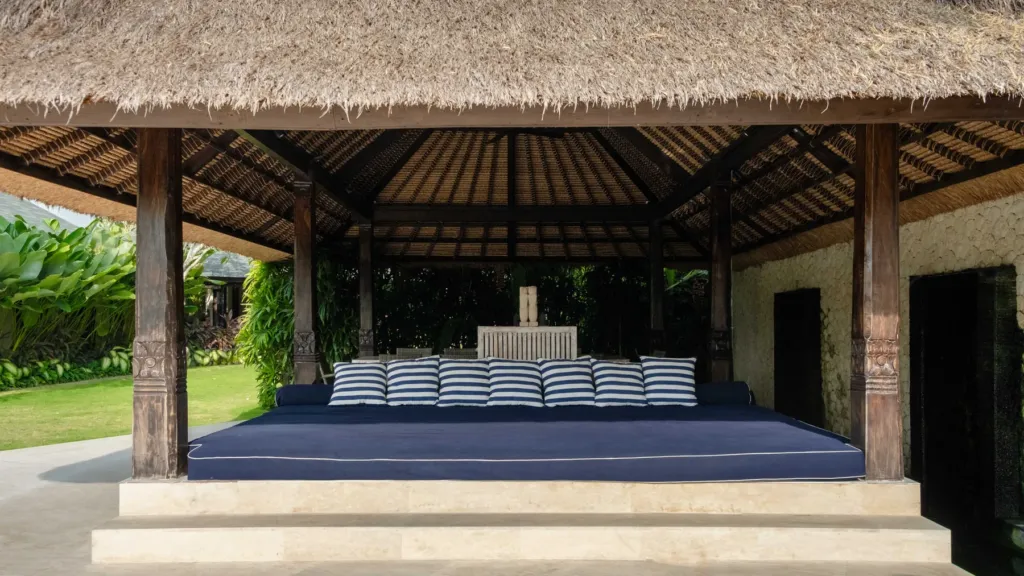 Poolside daybed bale at Villa Kubu Dewi Sri, a 5-bedroom private-pool villa in Berawa, Canggu, Bali