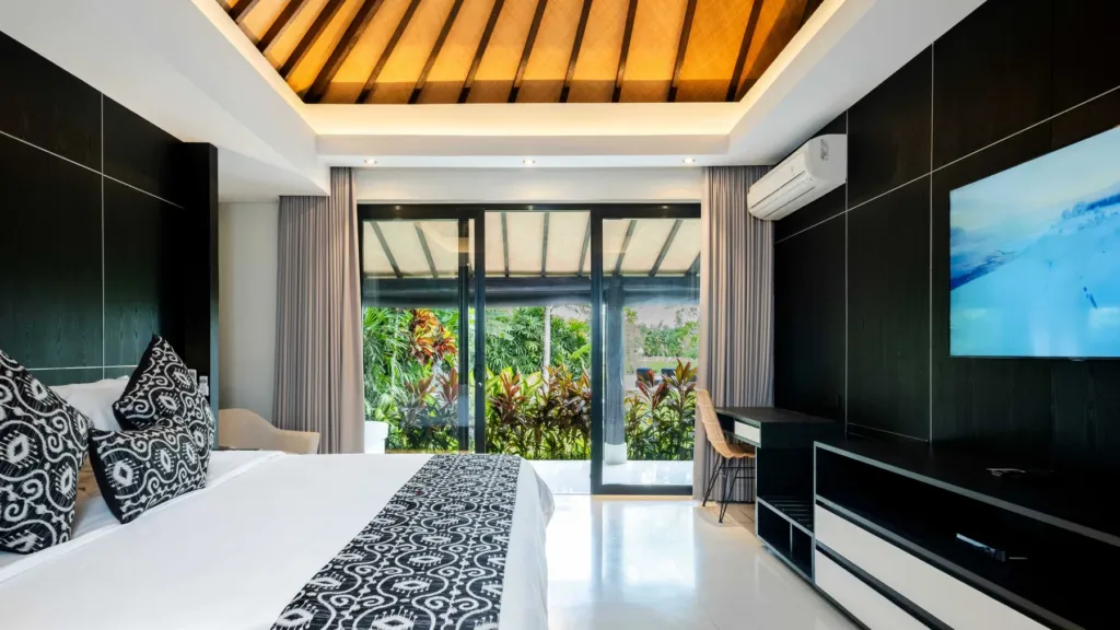 Bedroom three with tv at Villa Kubu Dewi Sri, a 5-bedroom private-pool villa in Berawa, Canggu, Bali