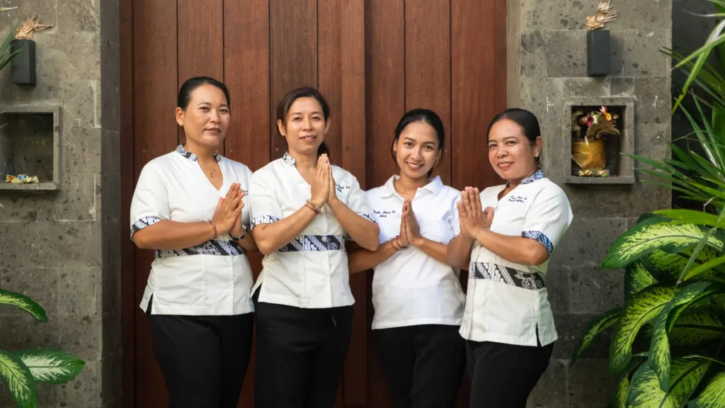 Villa Kubu Dewi Sri, Berawa — staff, the housekeeping team at the timber entrance doors