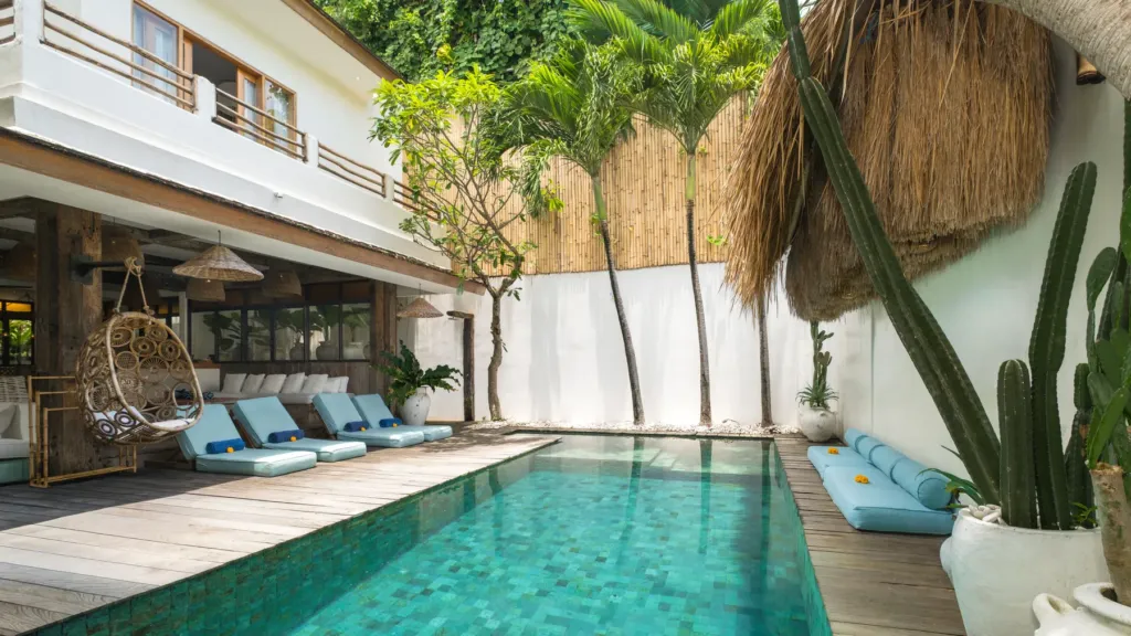 Pool and hanging chairs at Villa Metisse, a 4-bedroom private-pool villa in Seminyak, Bali