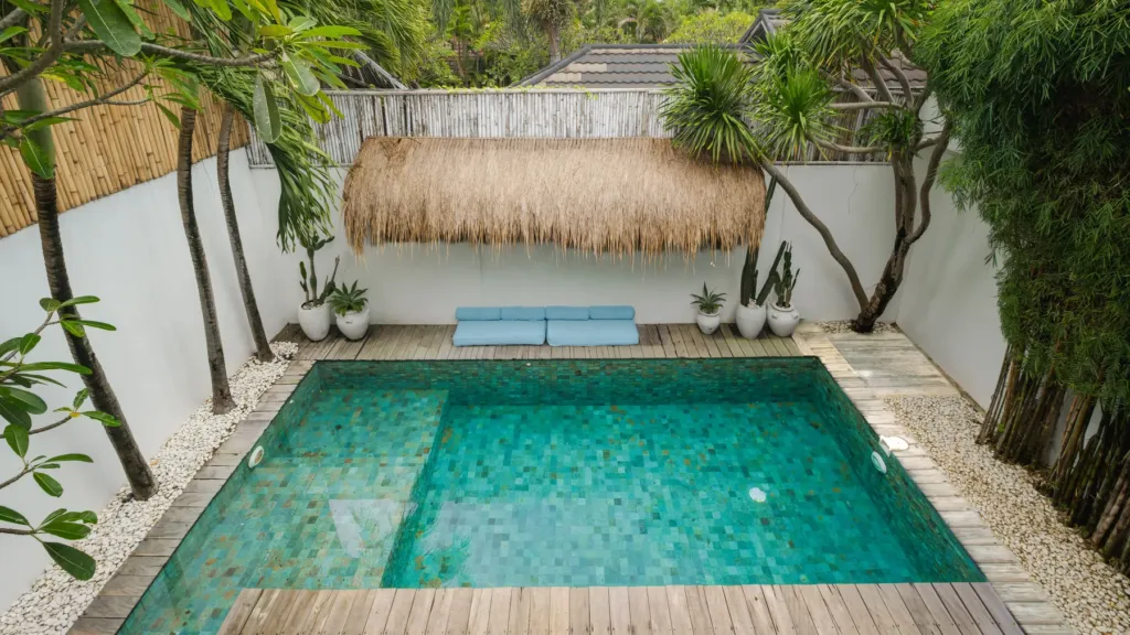 Green stone swimming pool at Villa Metisse, a 4-bedroom private-pool villa in Seminyak, Bali