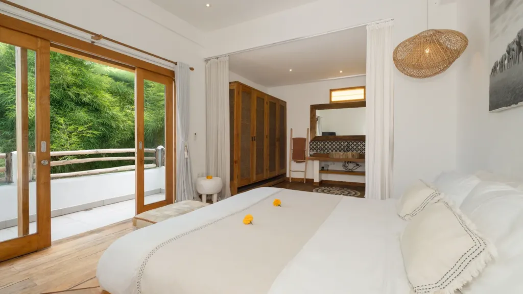 King bedroom with garden access at Villa Metisse, a 4-bedroom private-pool villa in Seminyak, Bali