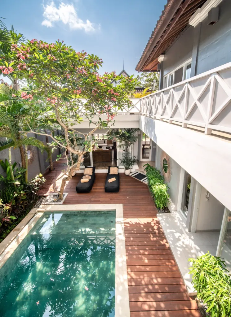 Villa Moana, Canggu — pool, villa Moana's pool and brick sun deck seen from the upper terrace