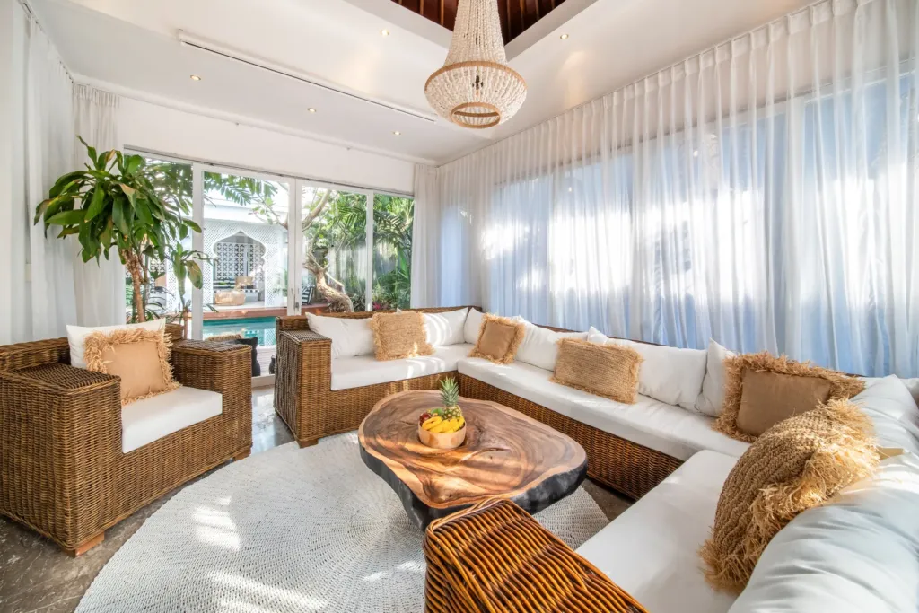 Villa Moana, Canggu — living room, sectional seating and round timber coffee table in Villa Moana's living room