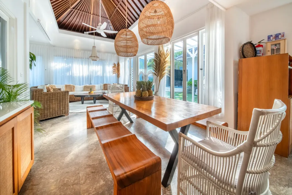Villa Moana, Canggu — dining, table and living area at Villa Moana under a pitched timber ceiling