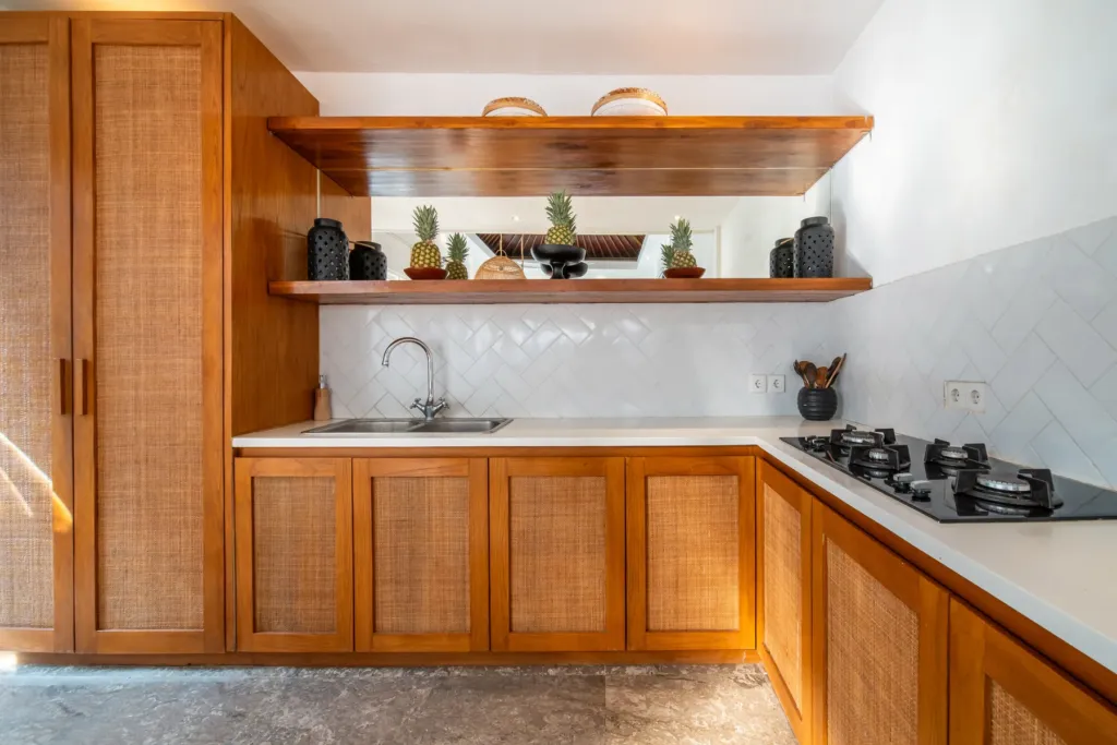 Villa Moana, Canggu — kitchen, fully equipped kitchen at Villa Moana with gas hob, timber cabinetry and open shelving