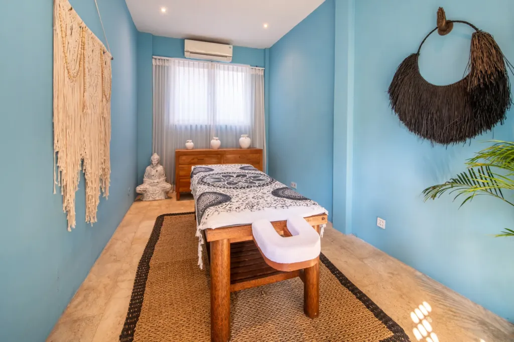 Private spa room at Villa Moana with massage table and macrame wall hanging