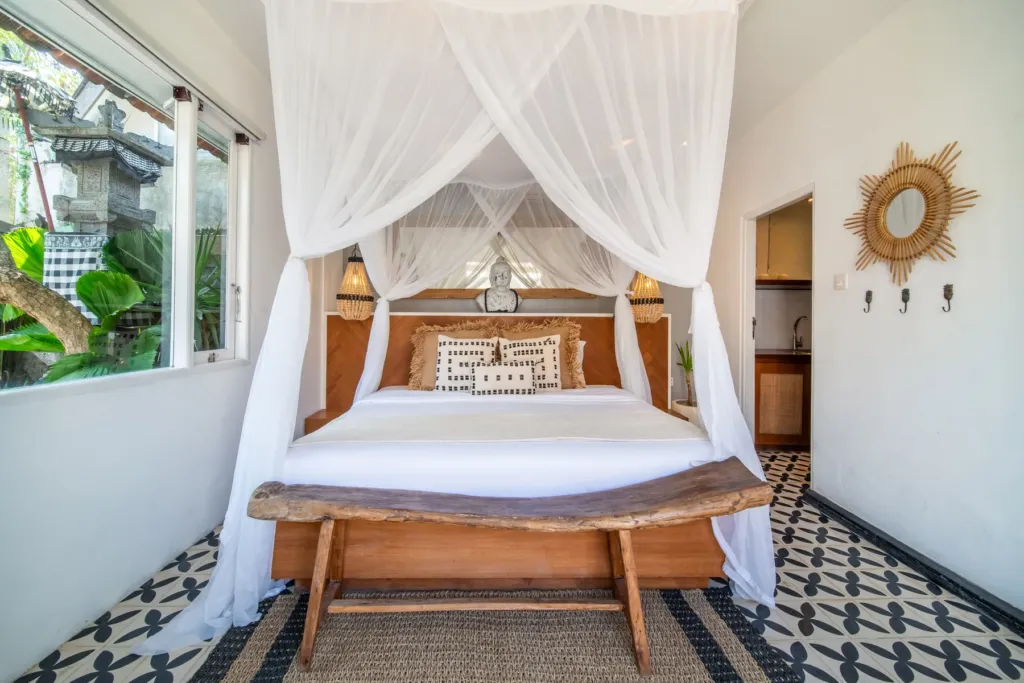 Villa Moana, Canggu — bedroom, king bedroom at Villa Moana with canopy bed and patterned cement tile floor