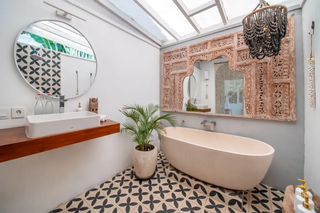 Villa Moana, Canggu — bathroom, villa Moana with double vanity, round mirror and carved timber panels