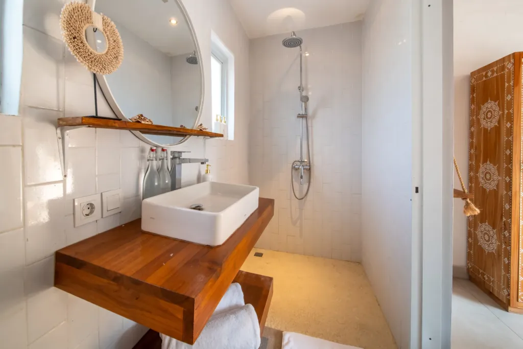 Villa Moana, Canggu — bathroom, master en-suite at Villa Moana with timber vanity, walk-in shower and carved screen