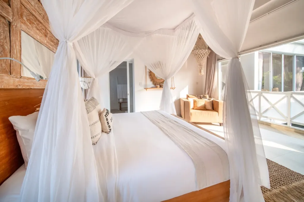 Villa Moana, Canggu — bedroom, canopy king bed at Villa Moana with timber headboard and macrame detail