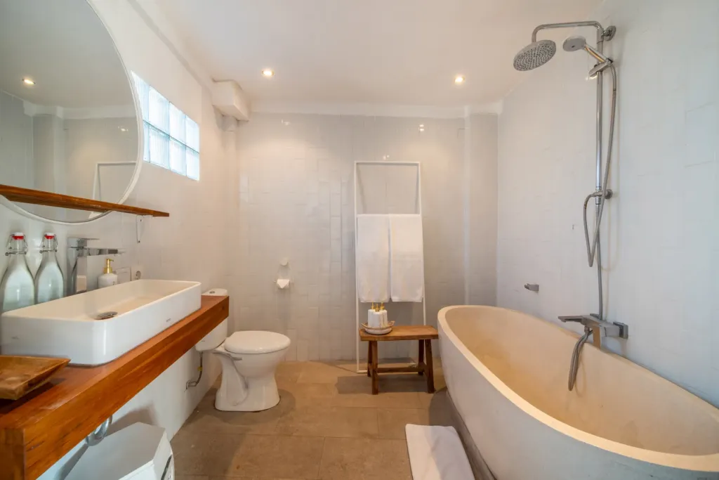Villa Moana, Canggu — bathroom, en-suite at Villa Moana with freestanding tub, walk-in shower and stone basin