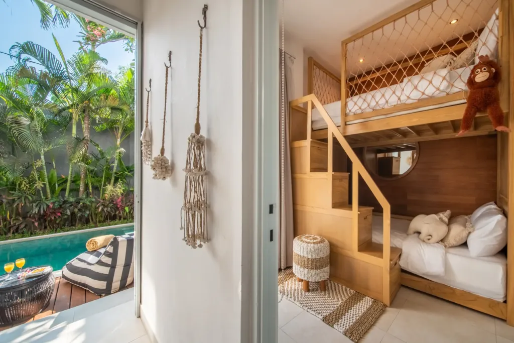Villa Moana, Canggu — bedroom, children's bunk room with timber bunk beds and a view out to the pool