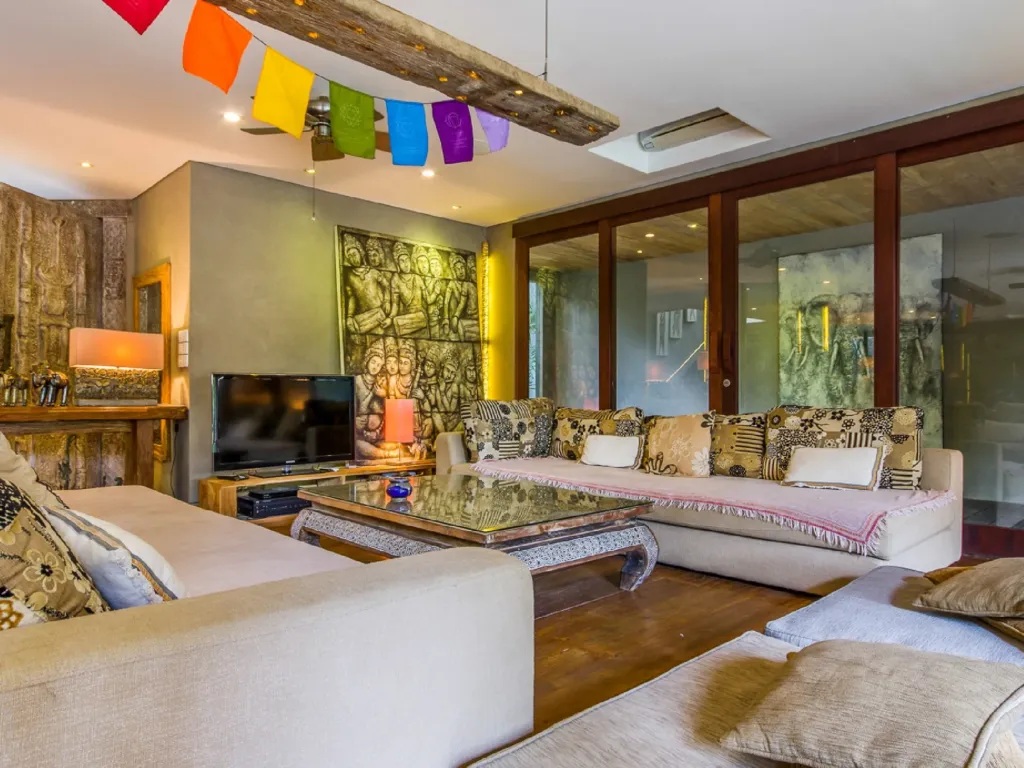 The living pavilion at Villa Yoga opening completely onto the pool deck