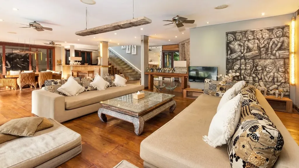 Poolside living area at Villa Yoga, open on three sides to the garden