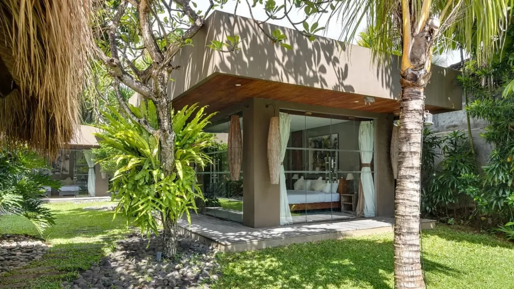 Mature palms and planting in the garden at Villa Yoga, Seminyak