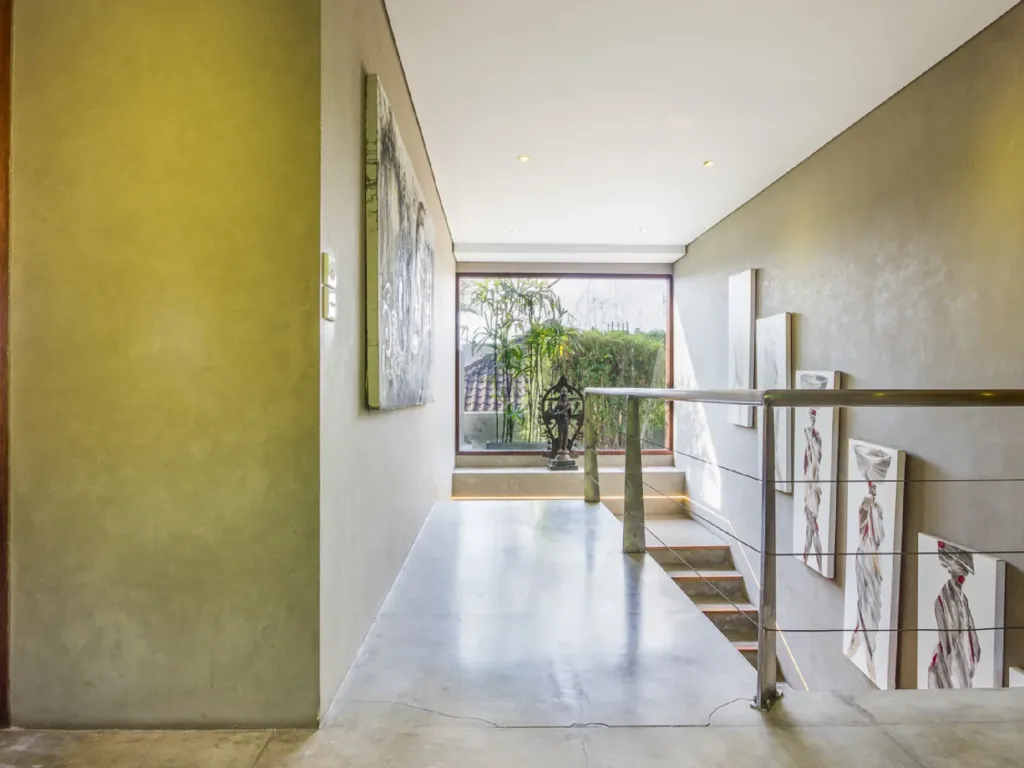 Staircase to the first-floor bedrooms in the main house at Villa Yoga