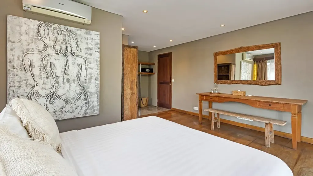 Bedroom 2 at Villa Yoga looking out over the pool from the teak terrace