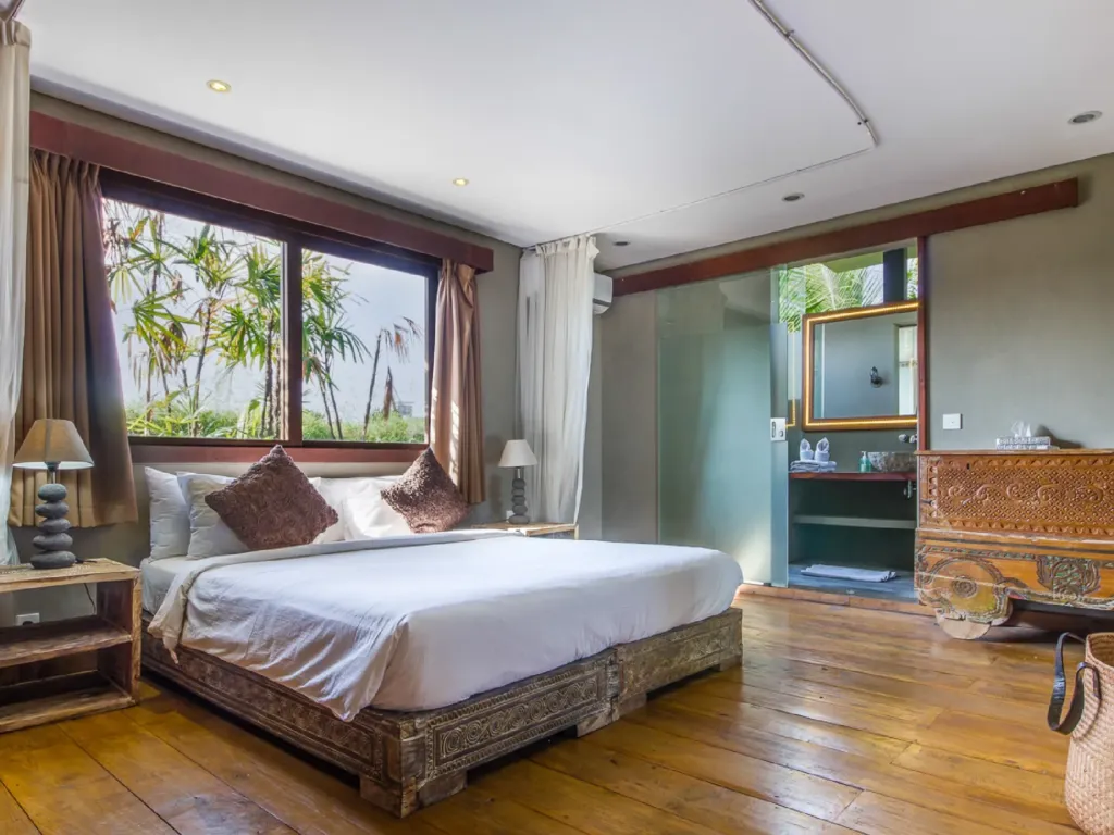 Bedroom 3 at Villa Yoga, made up as a king, with garden outlook