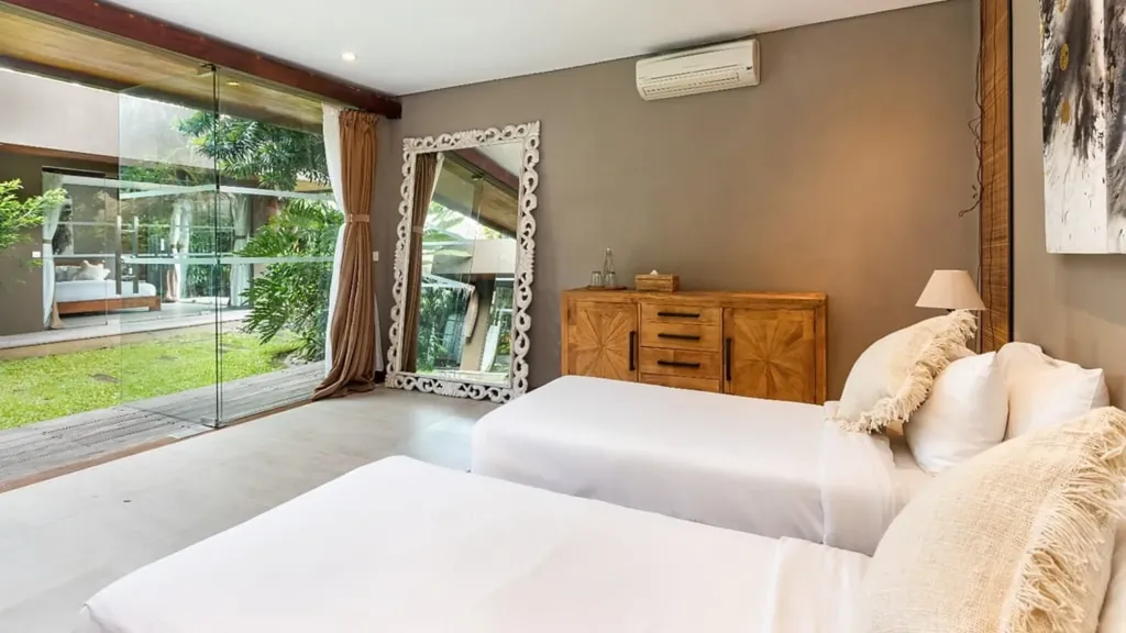 Bedroom 4 at Villa Yoga, a garden-level room with open wardrobe space