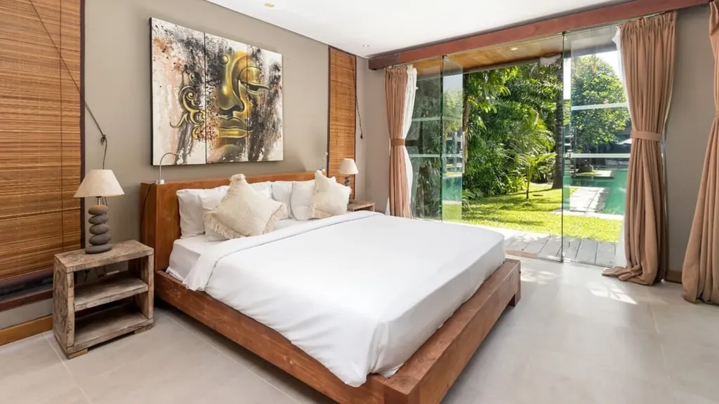 Bedroom 6 at Villa Yoga, a king room opening straight onto the lawn