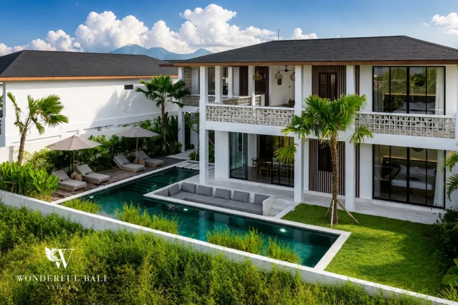4BR villa for rent in Pererenan — aerial, two-storey villa with an L-shaped pool and sun loungers