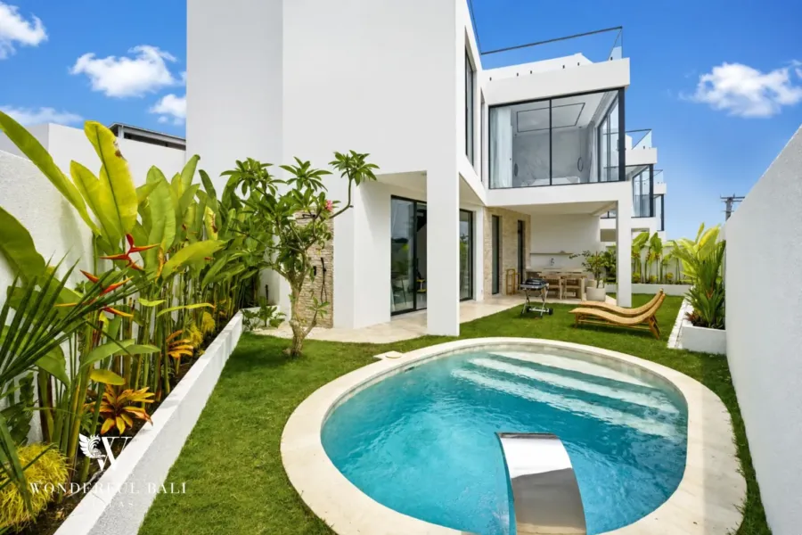 3BR villa for rent in Ungasan — pool, round private pool and lawn beside a white three-storey villa in Ungasan