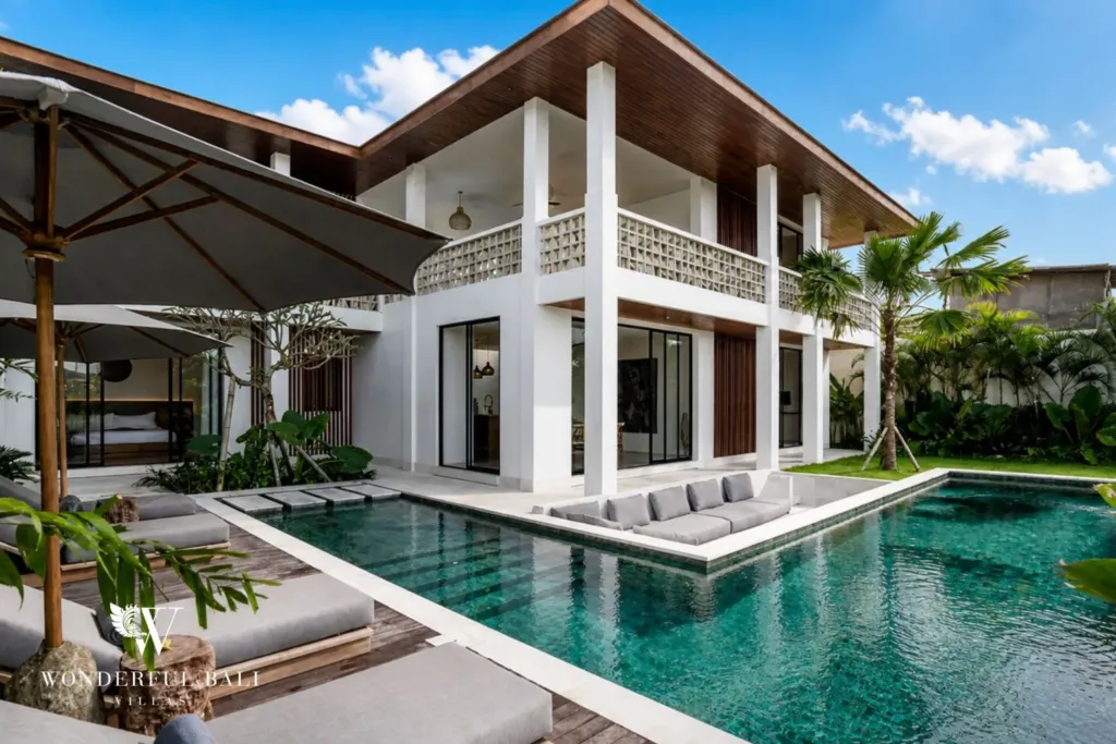 4BR villa for rent in Pererenan — pool, L-shaped pool with a sunken lounge and parasols