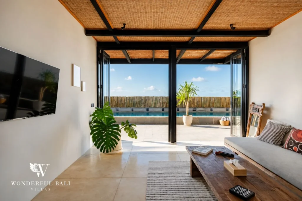 Living room with smart TV opening to the pool in a 5-bedroom villa in Uluwatu Bali