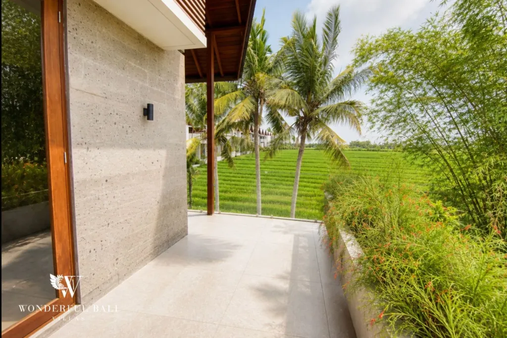 3BR villa for rent in Kedungu — exterior, side path along the villa with rice paddy on the boundary