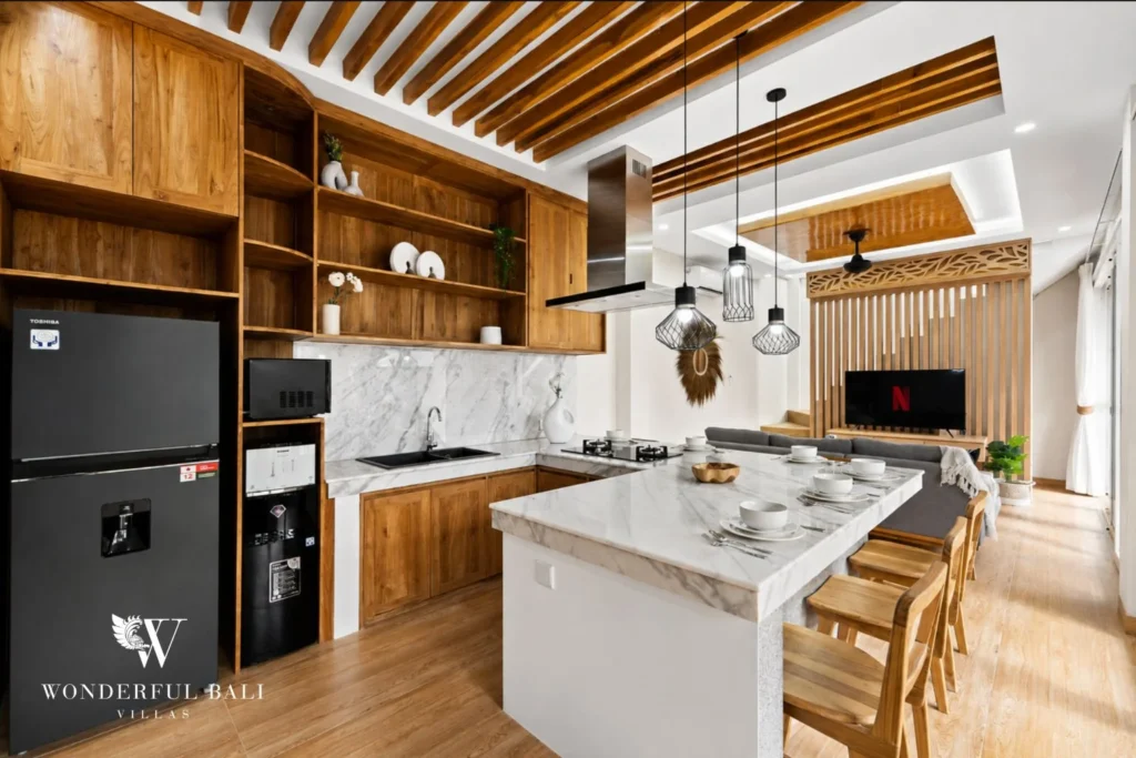 Teak kitchen with Carrara marble peninsula in a 3-bedroom villa in Tumbak Bayuh Bali