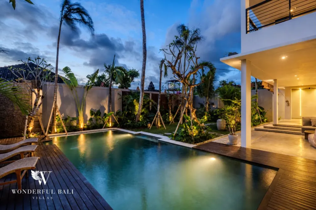 4BR villa for rent in Seminyak — pool, pool lit at night beside the covered terrace