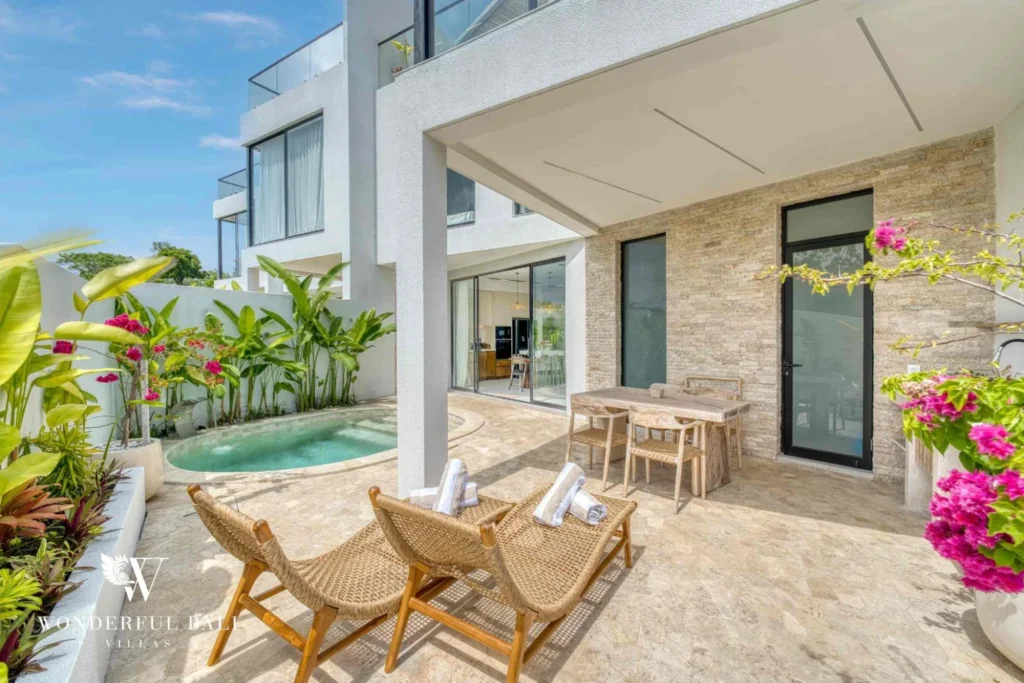 Covered terrace with rattan seating opening to the private pool at a 3-bedroom villa near Nusa Dua Bali