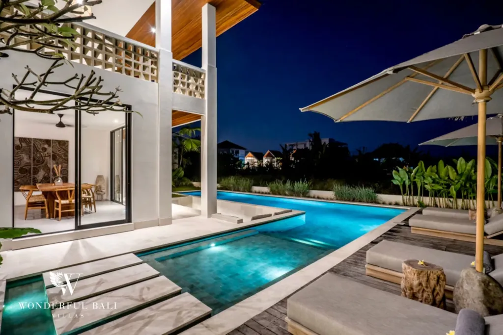 4BR villa for rent in Pererenan — pool, pool at night beside the glazed dining room