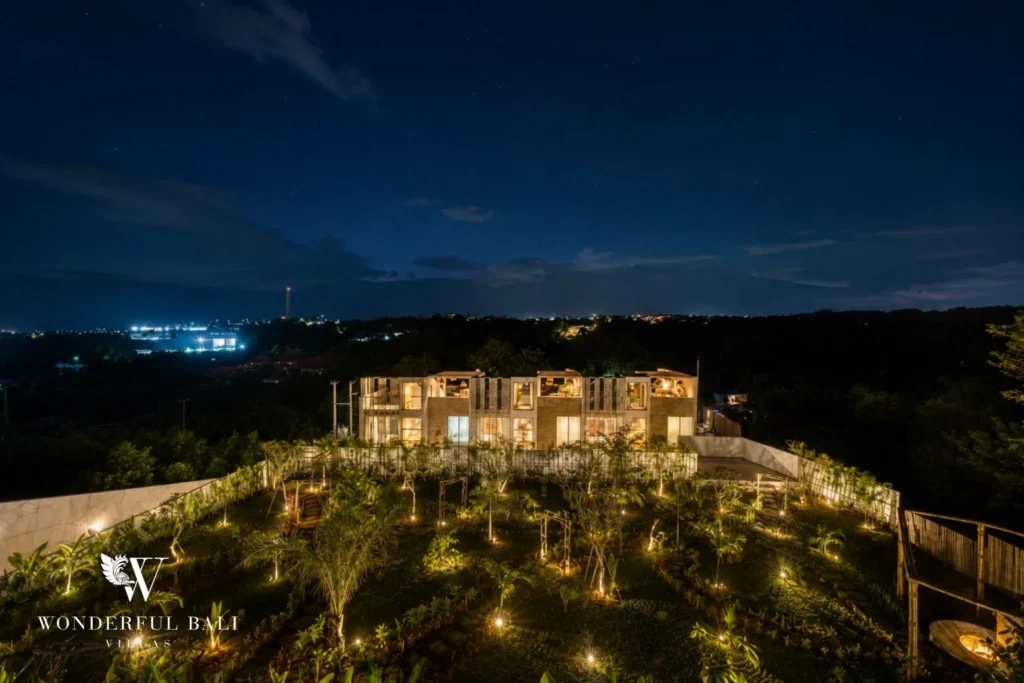 Aerial view at dusk of a gated terrace of white villas on the Bukit ridge near Nusa Dua Bali