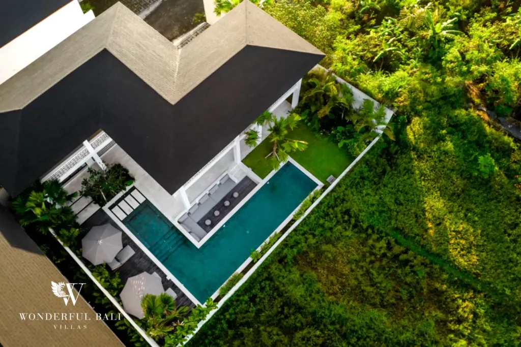 4BR villa for rent in Pererenan — aerial, top-down view of the L-shaped pool and lawn