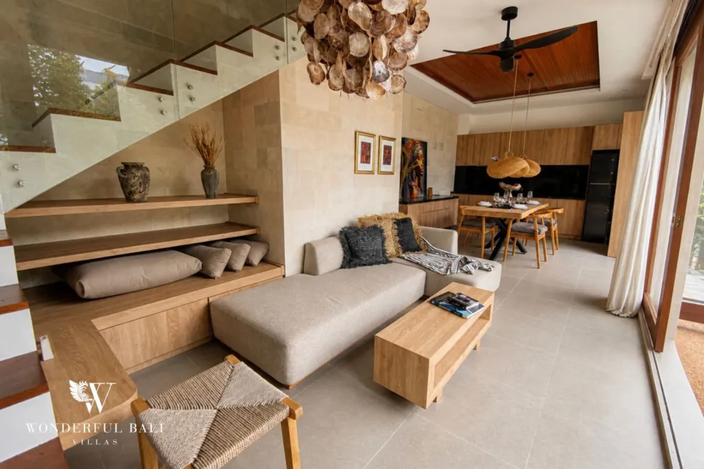 3BR villa for rent in Kedungu — living room, living area with the open staircase and dining beyond