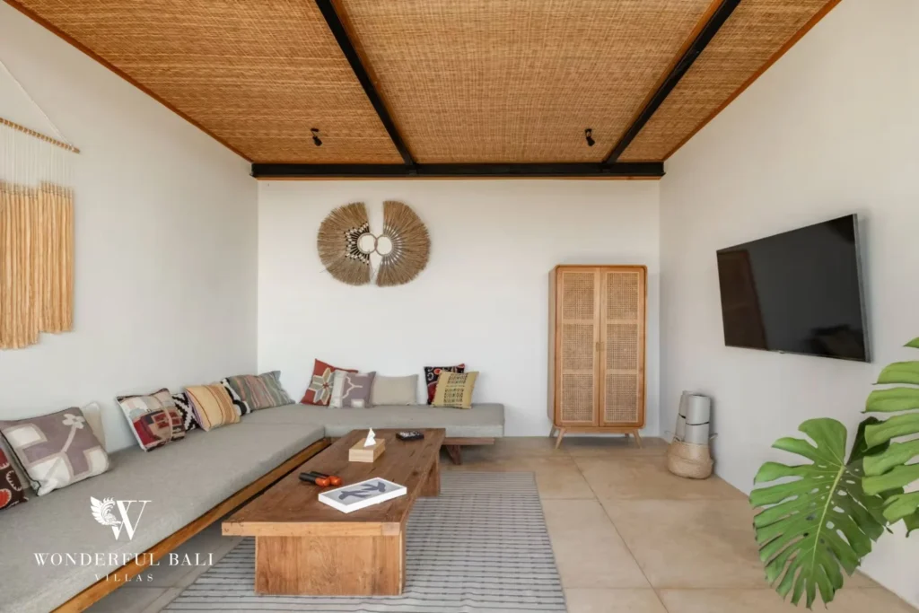 Enclosed TV lounge with low banquettes and kilim cushions in a 5-bedroom villa in Uluwatu Bali