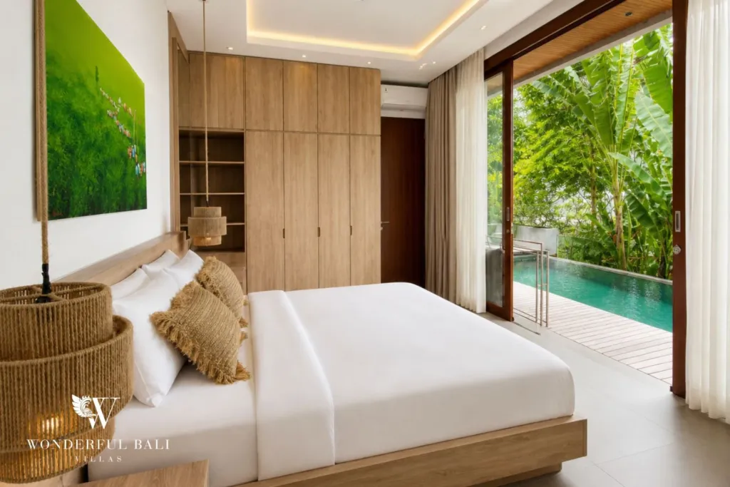3BR villa for rent in Kedungu — bedroom, bed with fitted wardrobes and sliding doors to the pool