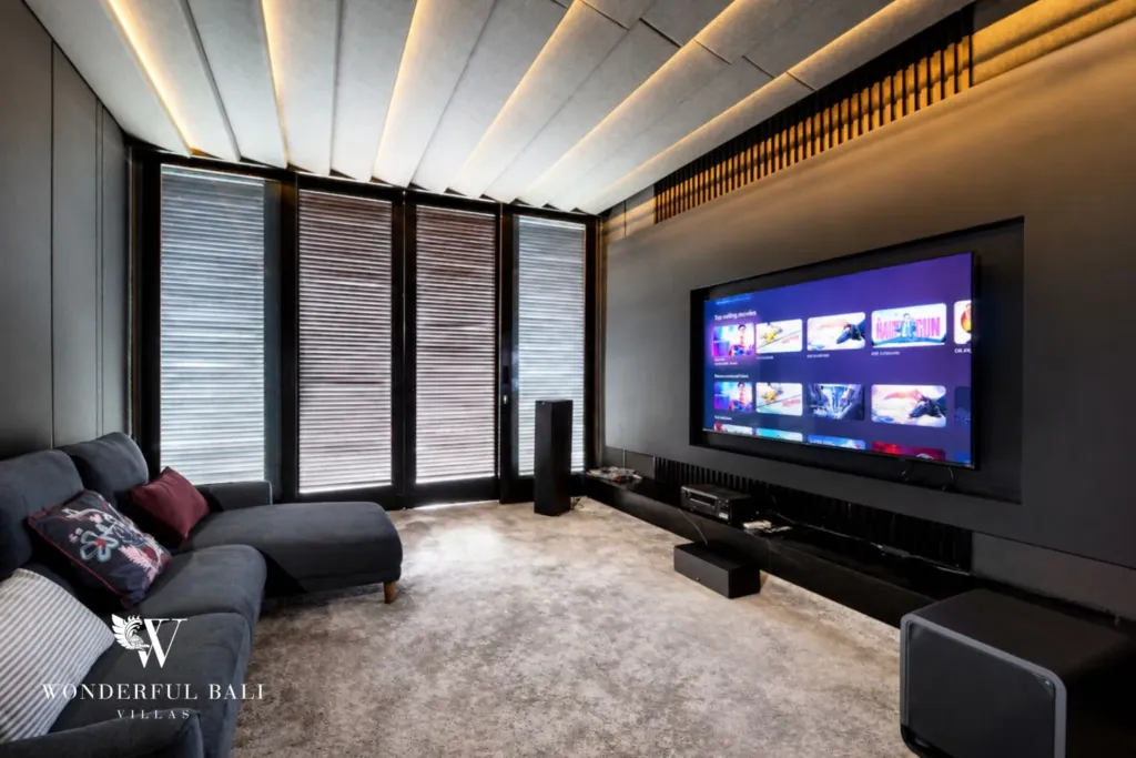 4BR villa for rent in Seminyak — cinema, media room with a 65-inch screen and a corner sofa
