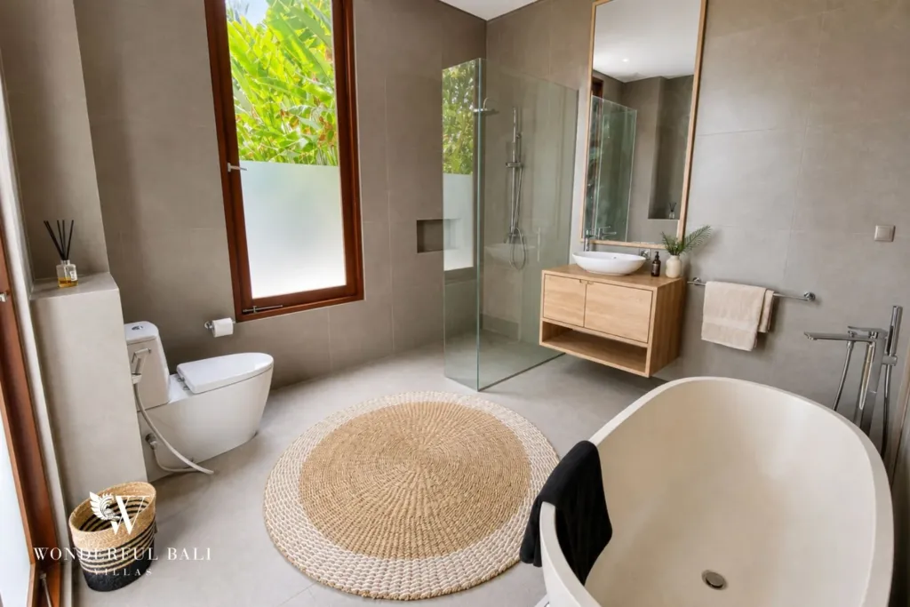 3BR villa for rent in Kedungu — bathroom, freestanding bathtub, walk-in shower and timber vanity