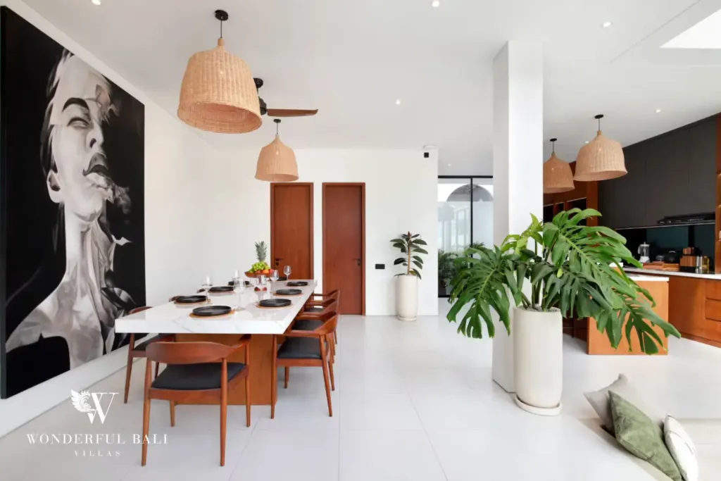 Dining area with mural and rattan pendant lights at a 3BR villa in Pererenan Bali
